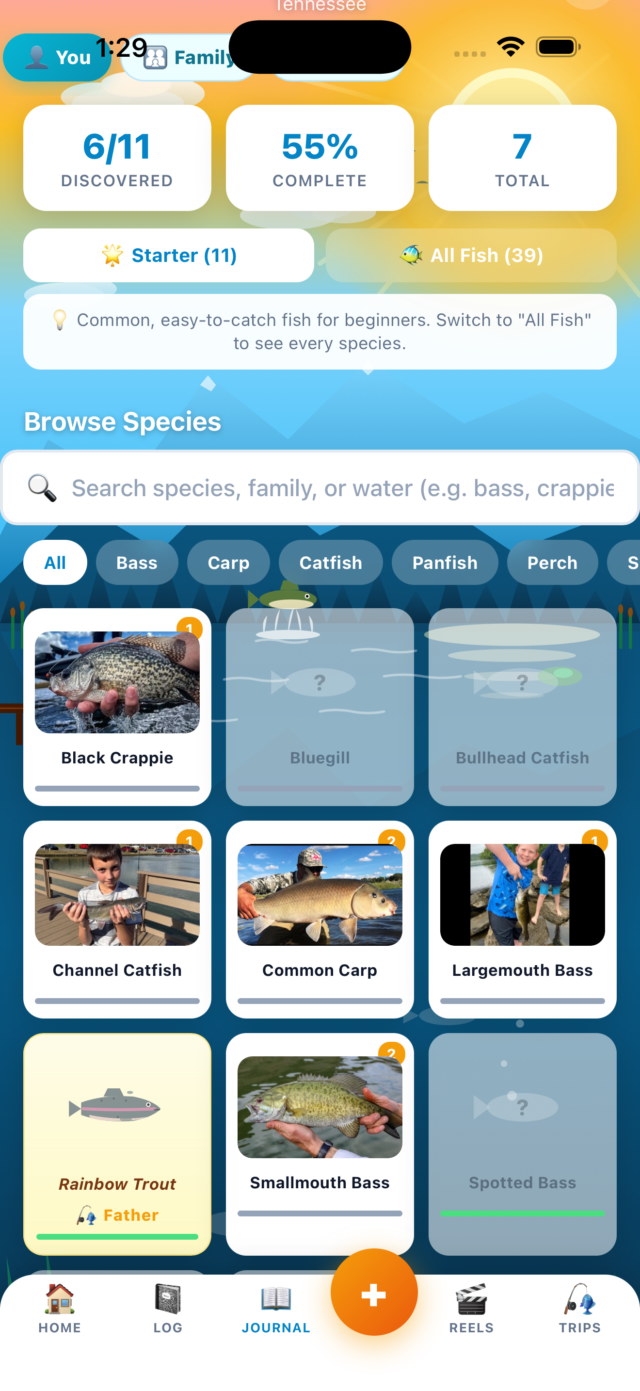 Fish Journal grid showing caught species in color, family-caught in gold, and locked silhouettes